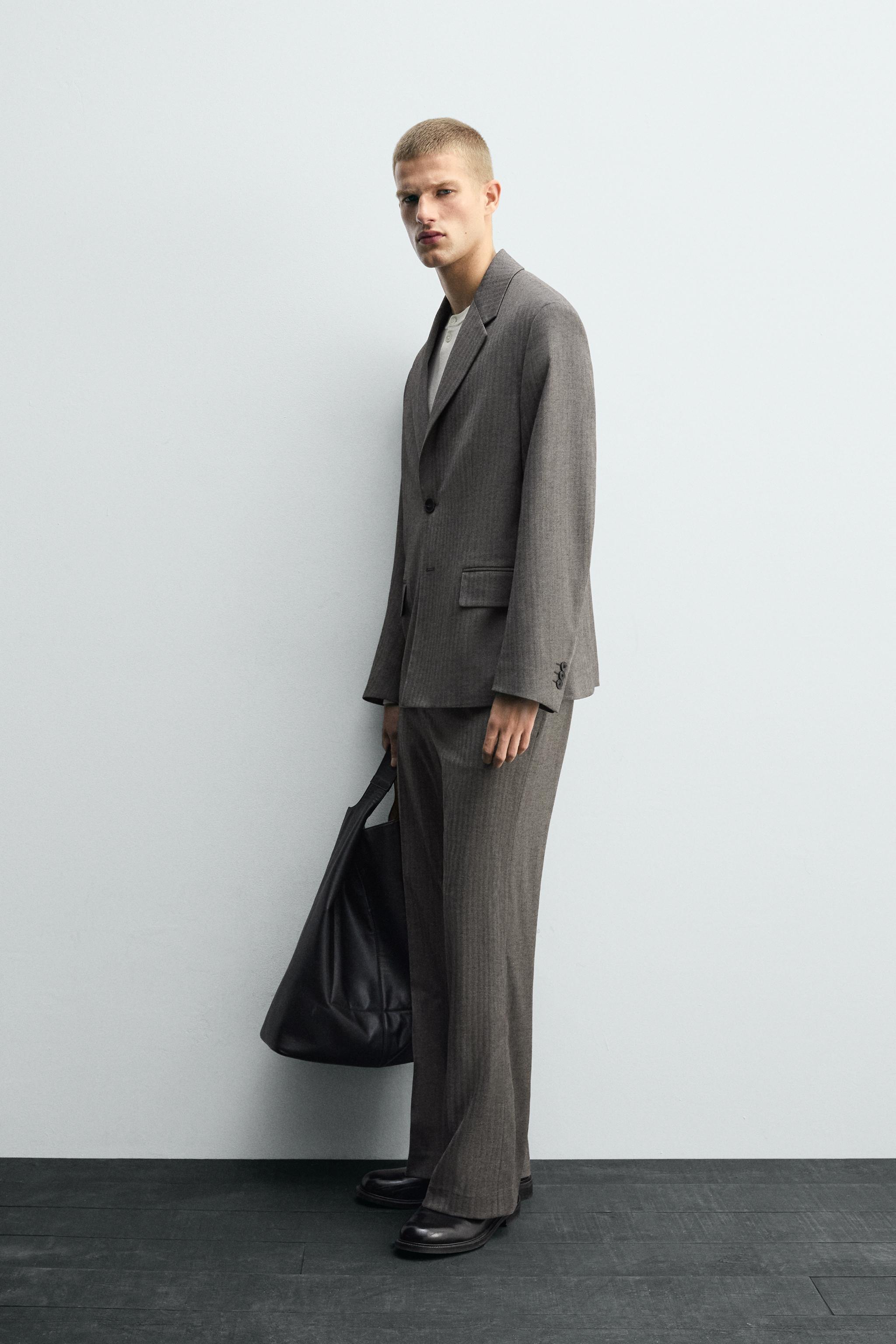 HERRINGBONE SUIT FLARE FIT PANTS